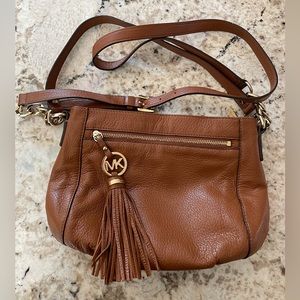 Michael Kors. Brown leather cross body. 11.5”L x 3.5”W x 7”H